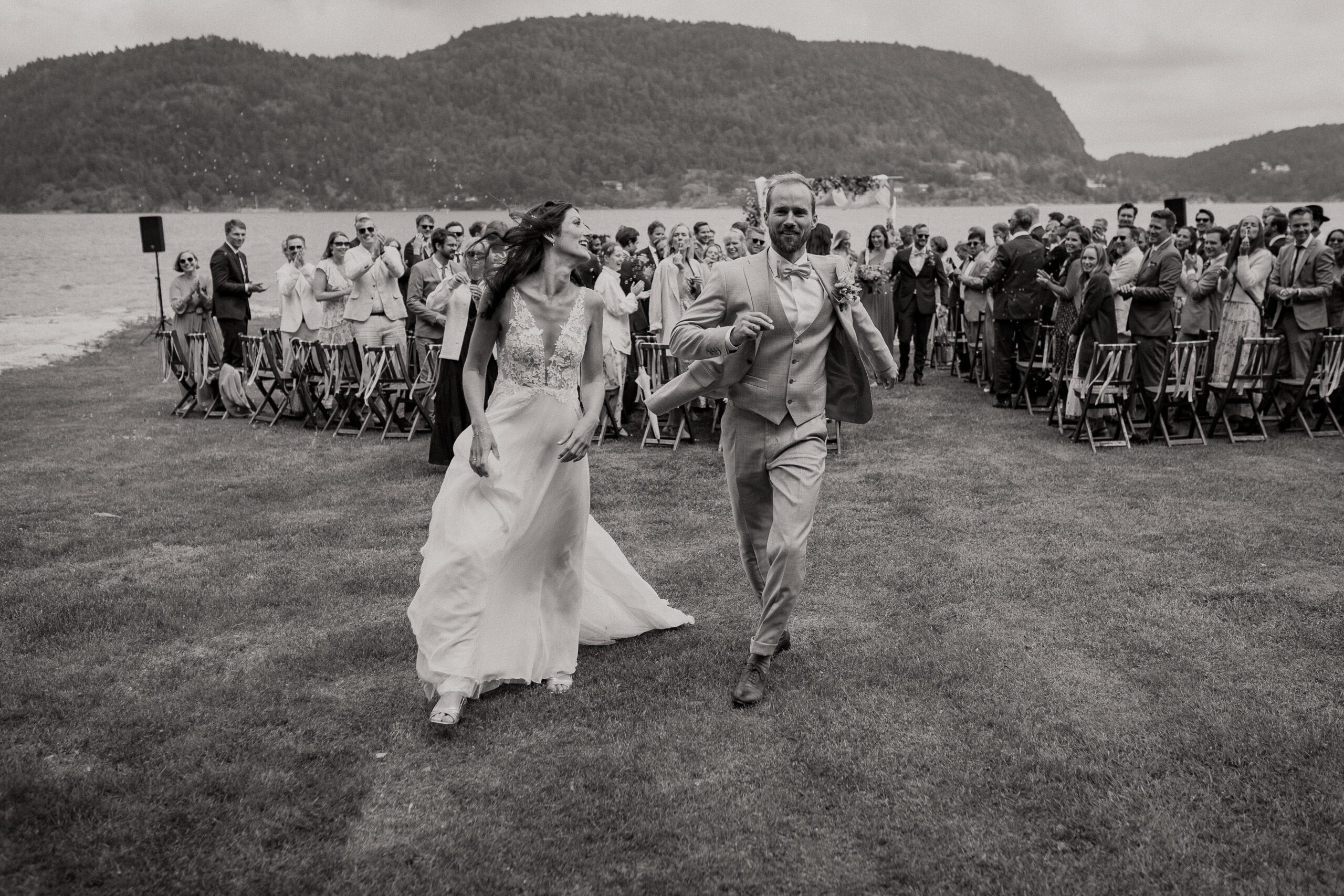bride and groom walk away after the I do's in Norway